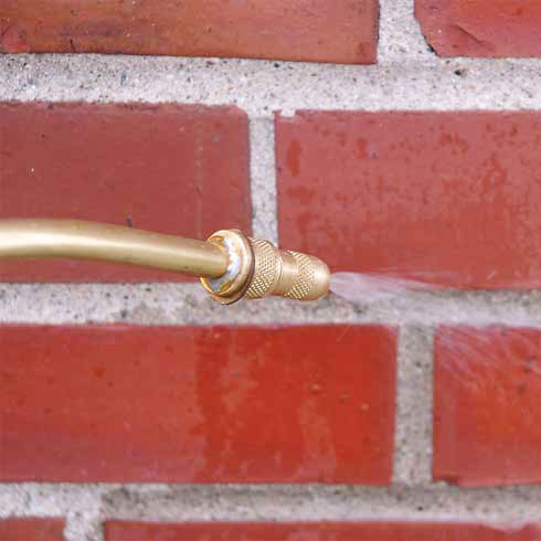 Close up of Water Repellent Spray Being Sprayed on Bricks
