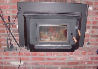 Electric Fireplace Installation in red brick surround and hearth