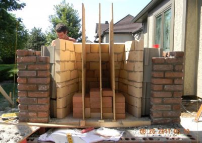 Technician working on outdoor chimney rebuild